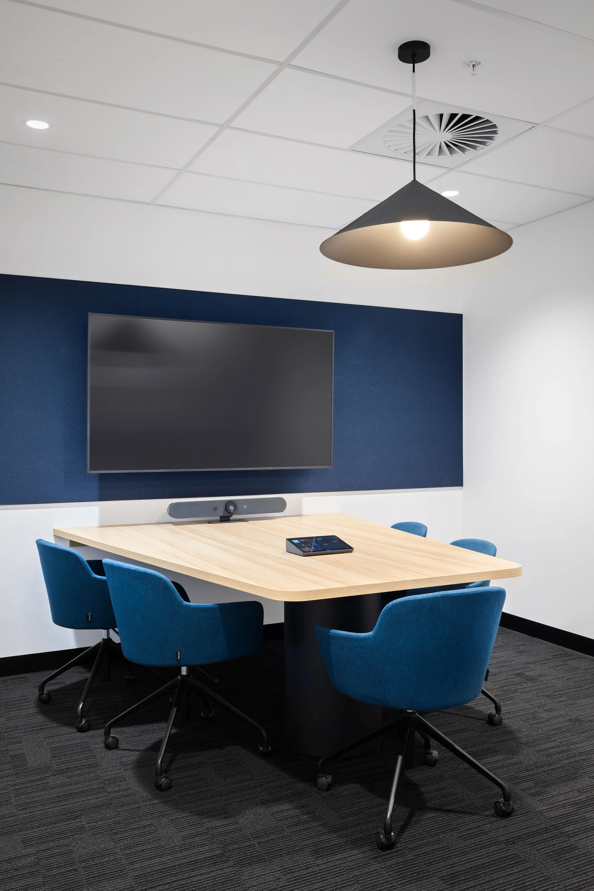 Quiet meeting room with Fortyfour tub chairs at a custom top on a Co-op table frame