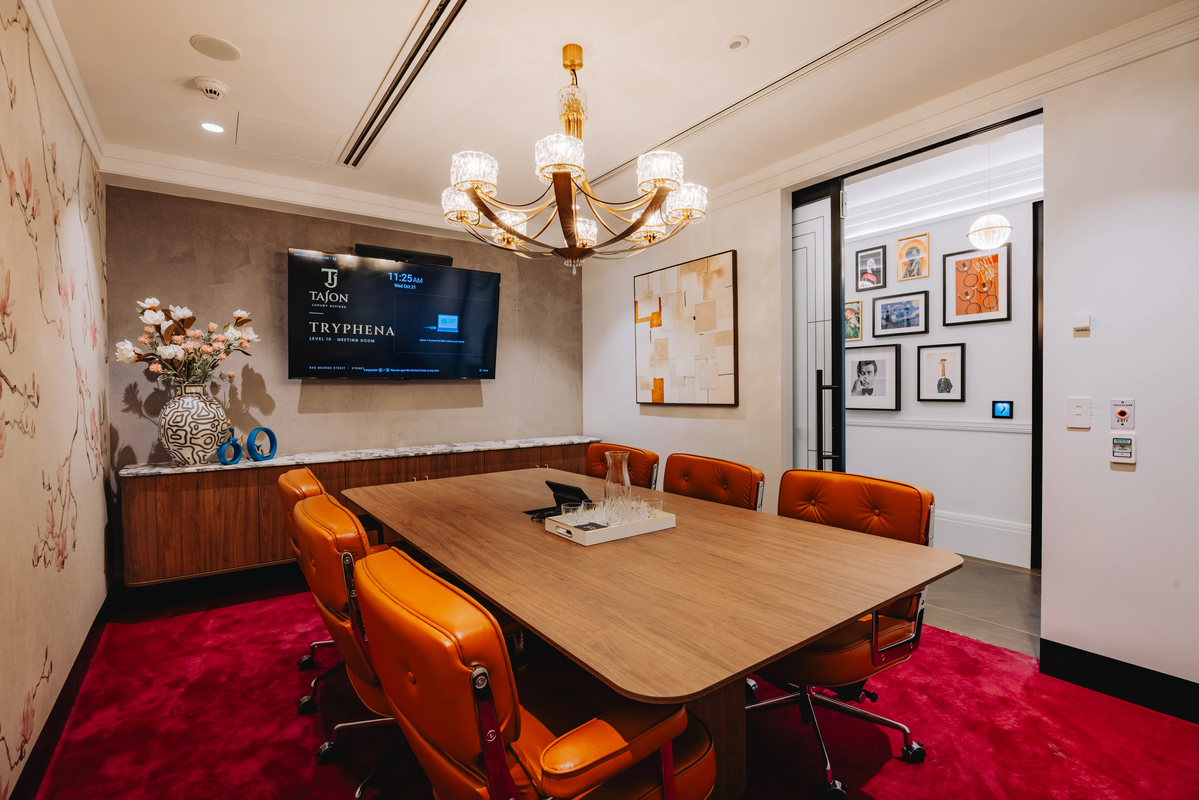 Architectural credenza framing a backlit display alcove with brass detailing and an integrated stone benchtop