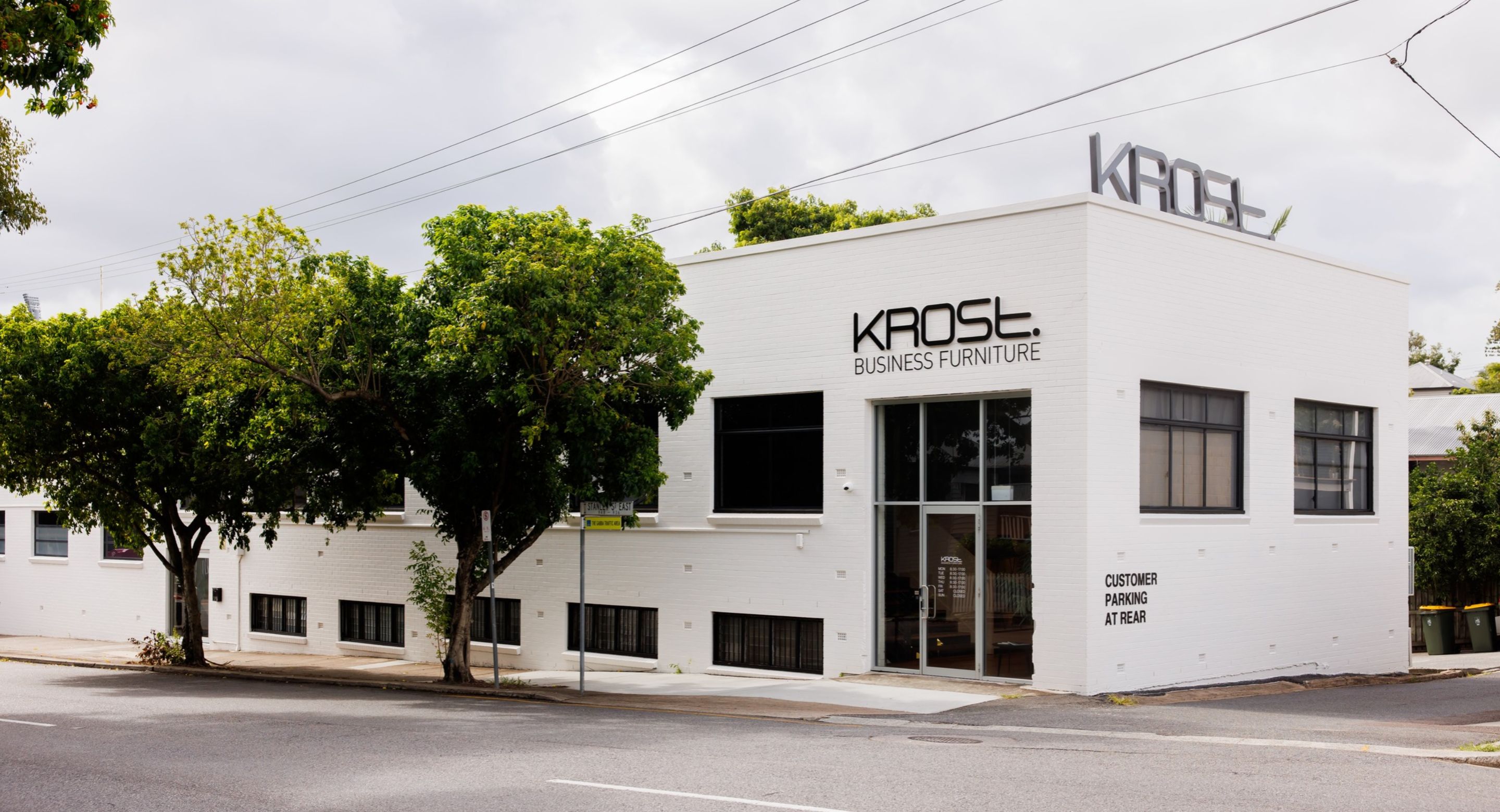 White brick exterior of the Krost Brisbane showroom on Stanley Street East