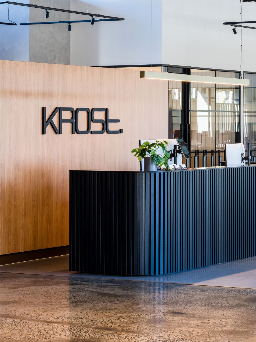 Reception desk and timber feature wall inside the Krost Melbourne showroom