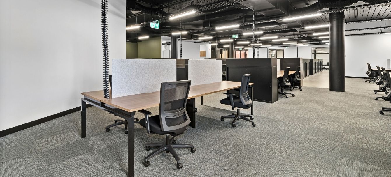 Open office with Benchwork and Swish workstations, grey Arc screens and task chairs