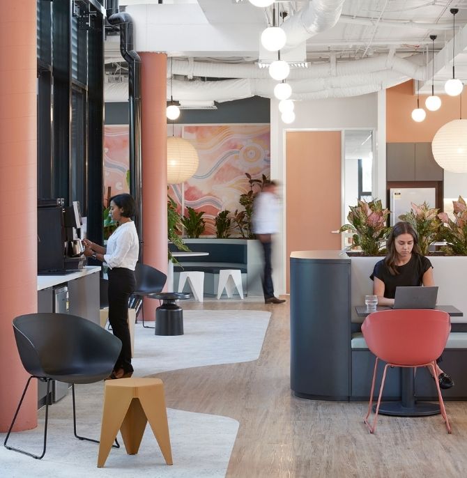 Tiered seating with integrated planter boxes beside the coffee station