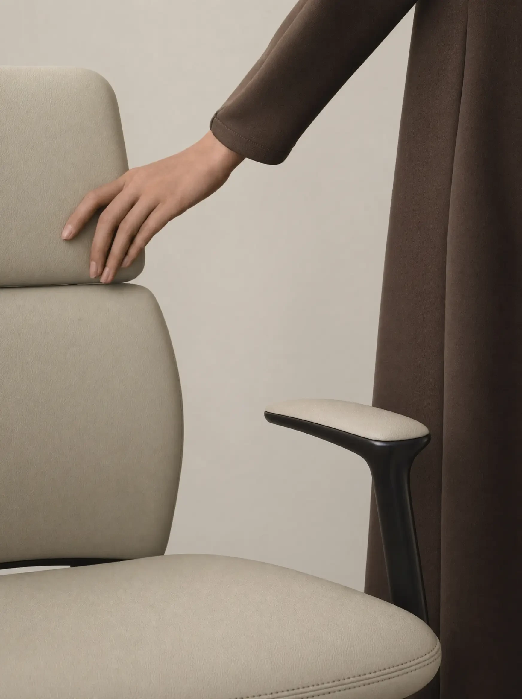Of oat Napa leather across the Anders seat edge, grain in sharp focus, stitch line running through frame,…
