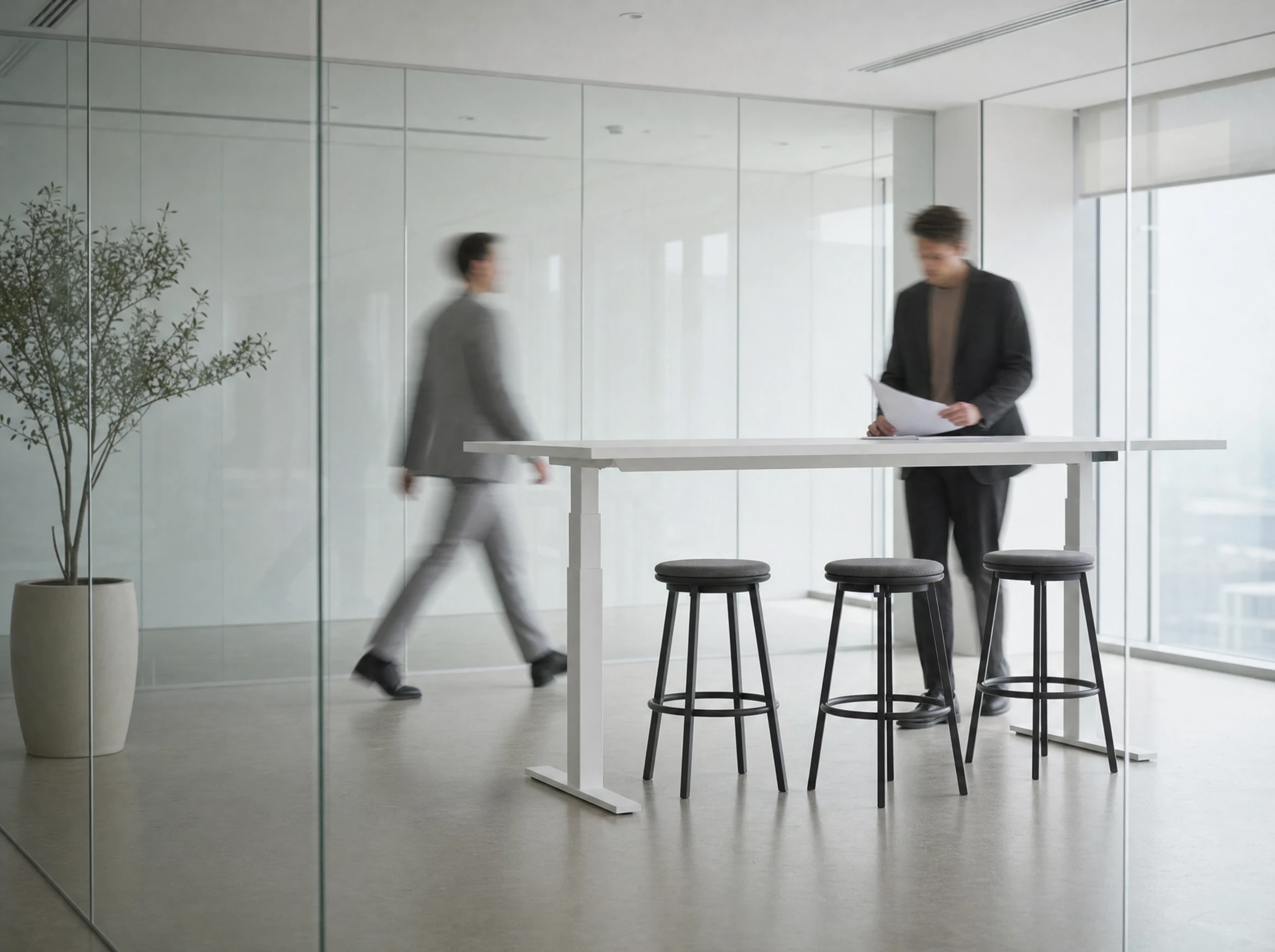 Swish Table in a meeting room raised to standing height, team gathered around it mid-discussion