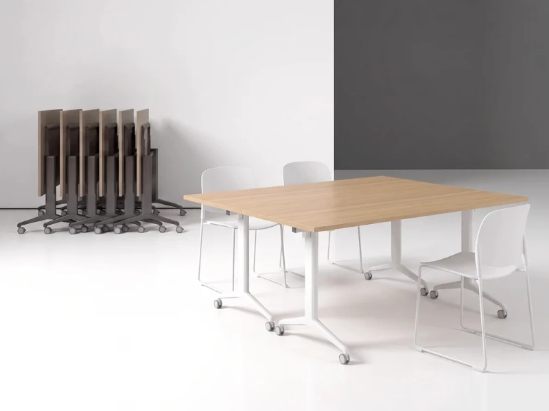 Krost Flip table nested vertically along perimeter wall